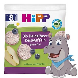 Balený potravinářský výrobek s kreslenou postavičkou hrocha na boku.