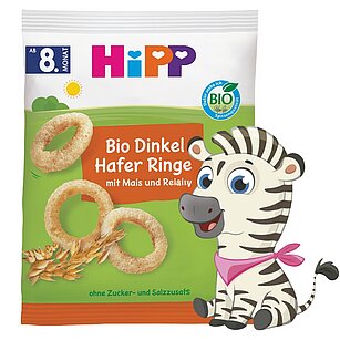 Balený potravinářský výrobek s maskotem zebry.