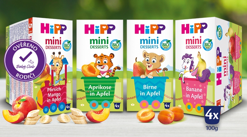 Před nimi jsou vystavena čtyři balení výrobků "Hipp mini dezerty", každé s jinou kombinací ovoce.