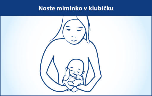 Matka drží své dítě.