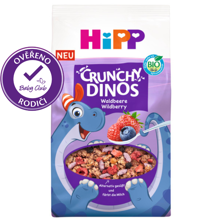 Balený potravinářský výrobek s kresleným dinosaurem, lžičkou rozmixovaných bobulí a razítkem 