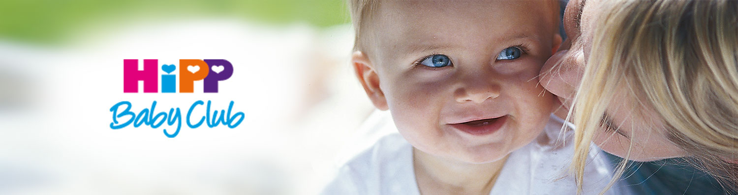 A close-up of a baby's face, with a partial view of an adult's face, alongside the text "HiPP Baby Club."